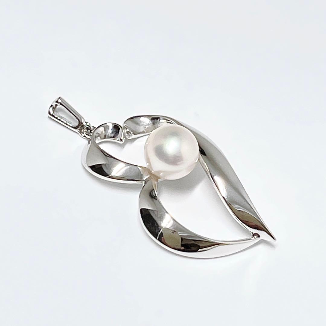 MIKIMOTO genuine pearl necklace featuring 6.7mm pearls on a silver chain weighing 2.3 grams