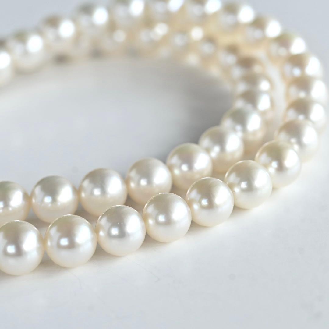 Premium flower pearl necklace with round pearls and silver clasp featuring a small diamond