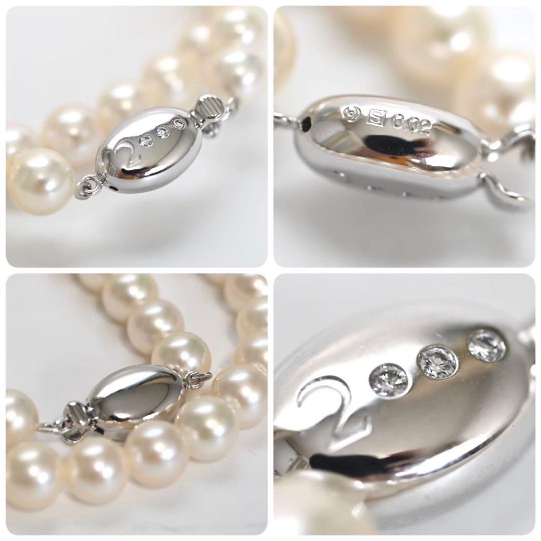 Premium flower pearl necklace with round pearls and silver clasp featuring a small diamond