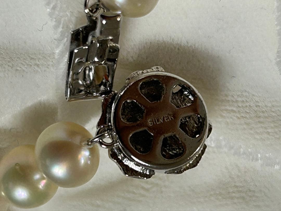Akoya pearl necklace 8-8.5mm with K14WG earring set and silver single earring displayed on white background