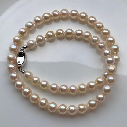 Honolulu Pearl Akoya pearl necklace with 54 toned champagne pearls, 6.8-7.5mm size, 43cm length, silver clasp
