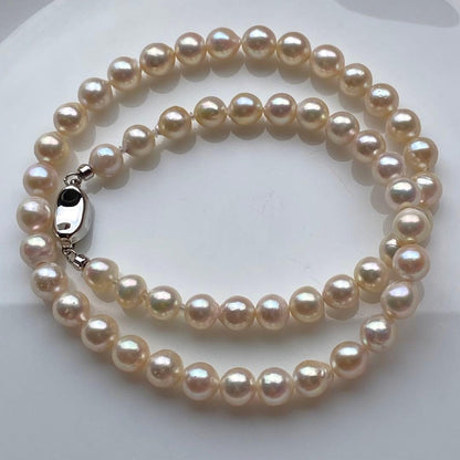 Honolulu Pearl Akoya pearl necklace with 54 toned champagne pearls, 6.8-7.5mm size, 43cm length, silver clasp