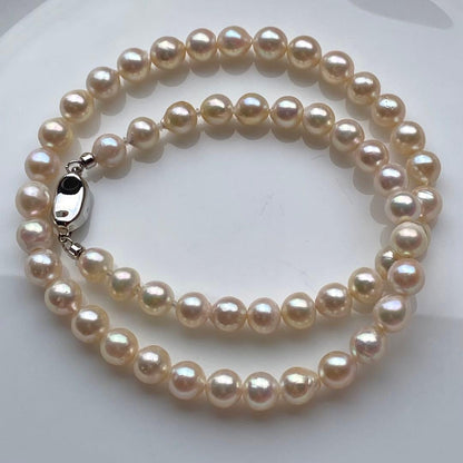 Honolulu Pearl Akoya pearl necklace with 54 toned champagne pearls, 6.8-7.5mm size, 43cm length, silver clasp