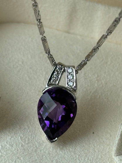 Tasaki amethyst purple gemstone diamond pendant top in white gold metal weighing 3.9 grams