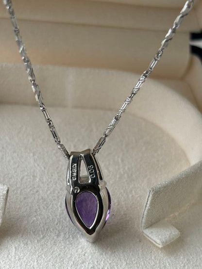 Tasaki amethyst purple gemstone diamond pendant top in white gold metal weighing 3.9 grams