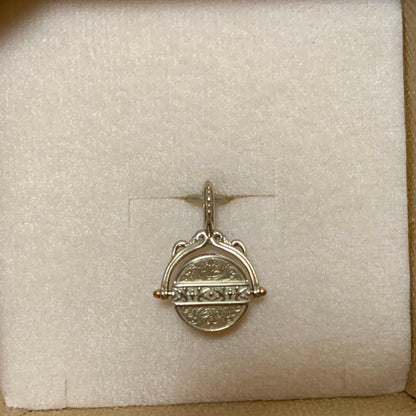 Agete 33rd anniversary charm accessory with intricate design, shown on a white background