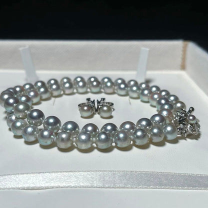 Akoya pearl necklace and earring set with round 7.0-7.4mm pearls on silver metal in green tone, necklace length 46.5 cm