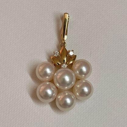 Mikimoto K18 gold pendant top featuring a 6.5-7mm pearl and diamond accents with detailed bail