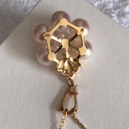 Mikimoto K18 gold pendant top featuring a 6.5-7mm pearl and diamond accents with detailed bail