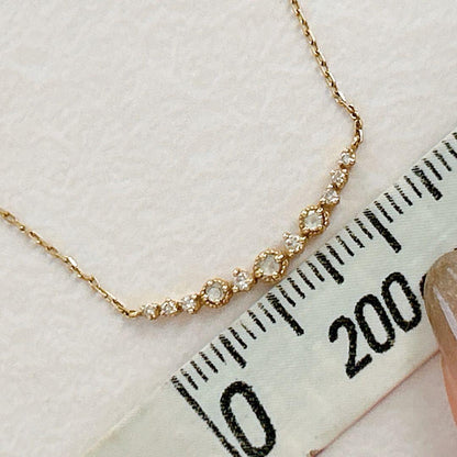 agete K18 gold necklace with 0.09 carat diamonds and 40 cm chain on white background
