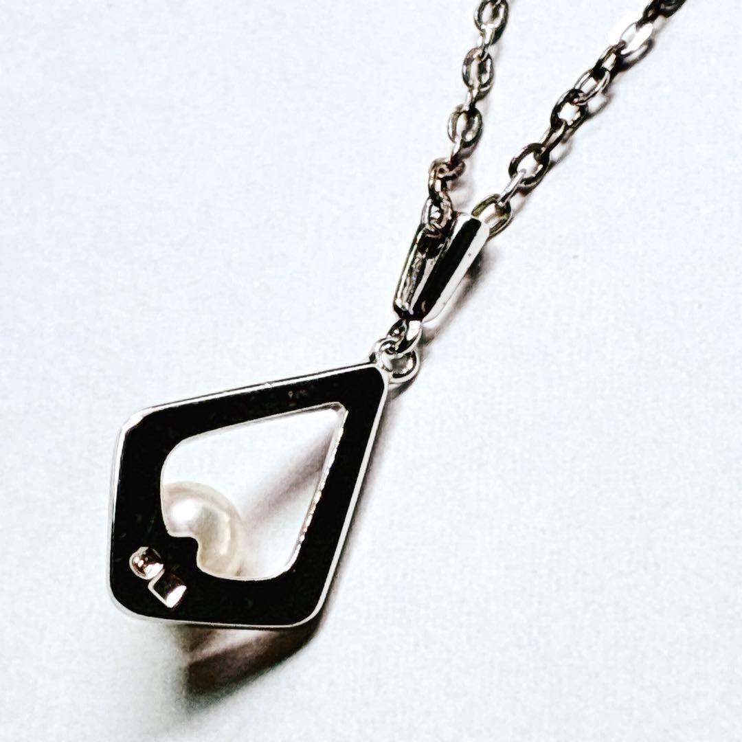 Mikimoto Akoya baby pearl necklace with 38 cm silver chain and engraved clasp shown on white background