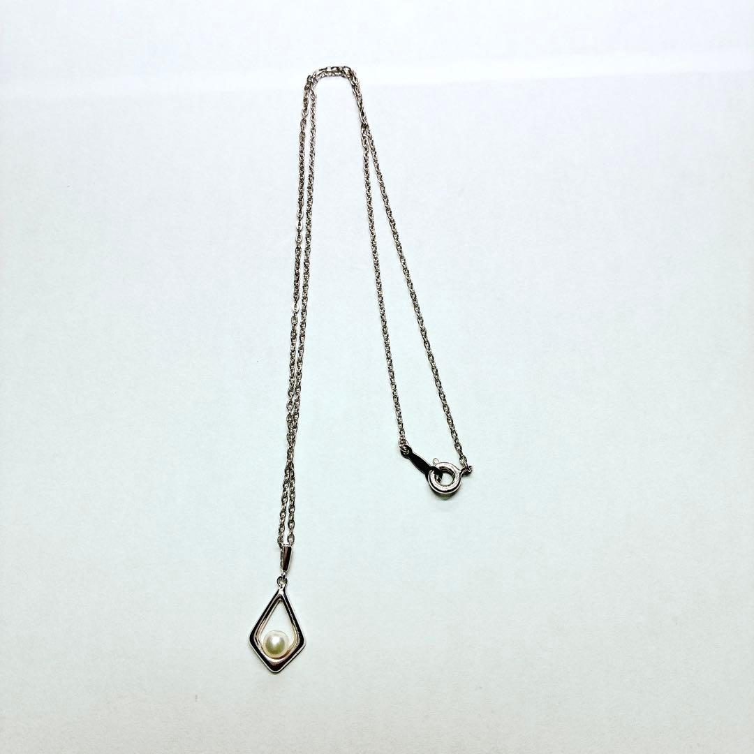 Mikimoto Akoya baby pearl necklace with 38 cm silver chain and engraved clasp shown on white background