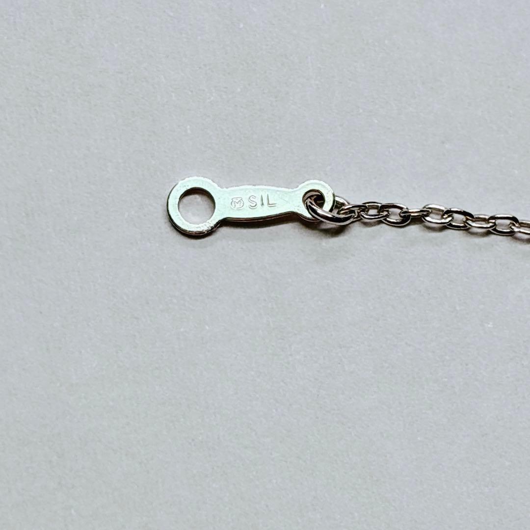 Mikimoto Akoya baby pearl necklace with 38 cm silver chain and engraved clasp shown on white background