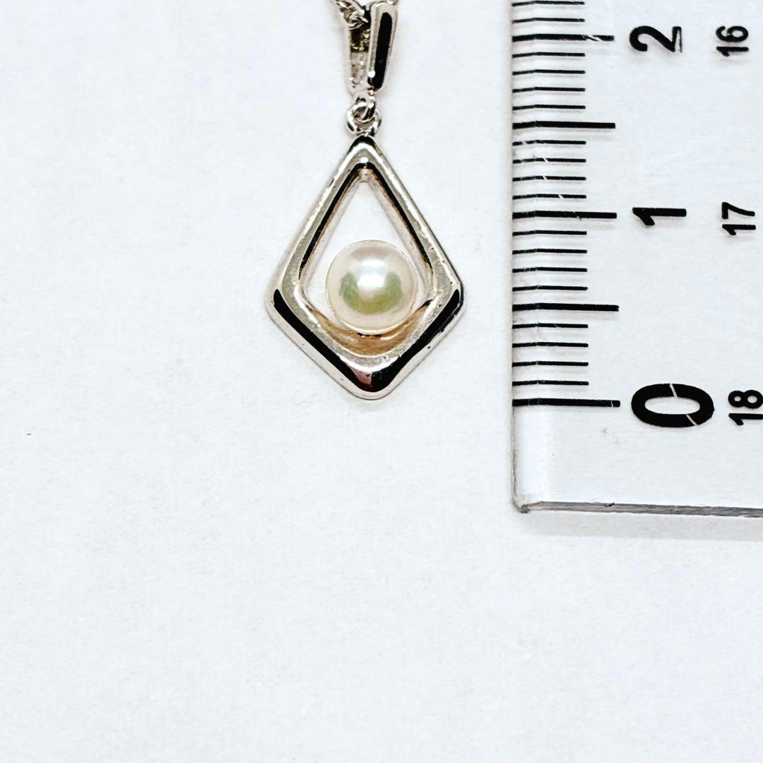Mikimoto Akoya baby pearl necklace with 38 cm silver chain and engraved clasp shown on white background