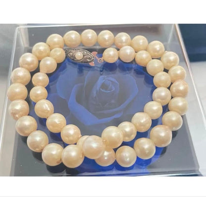 Vintage Akoya pearl necklace with 7.5mm semi-baroque cream-white pearls and silver clasp, 38cm length choker