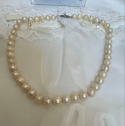 Vintage Akoya pearl necklace with 7.5mm semi-baroque cream-white pearls and silver clasp, 38cm length choker