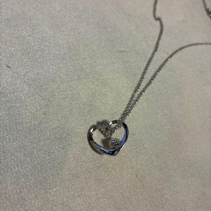 Mikimoto silver necklace featuring a 6.5mm pearl set in a heart-shaped motif pendant on a 40cm chain