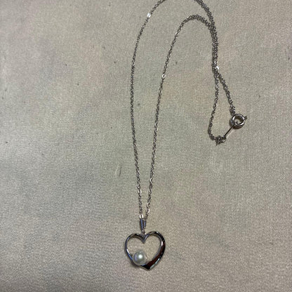 Mikimoto silver necklace featuring a 6.5mm pearl set in a heart-shaped motif pendant on a 40cm chain