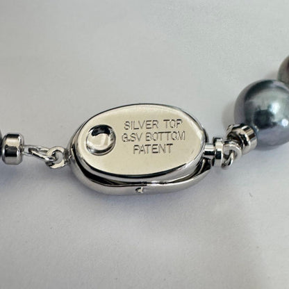 Akoya pearl necklace 42cm with natural white pearls and a silver clasp on white background