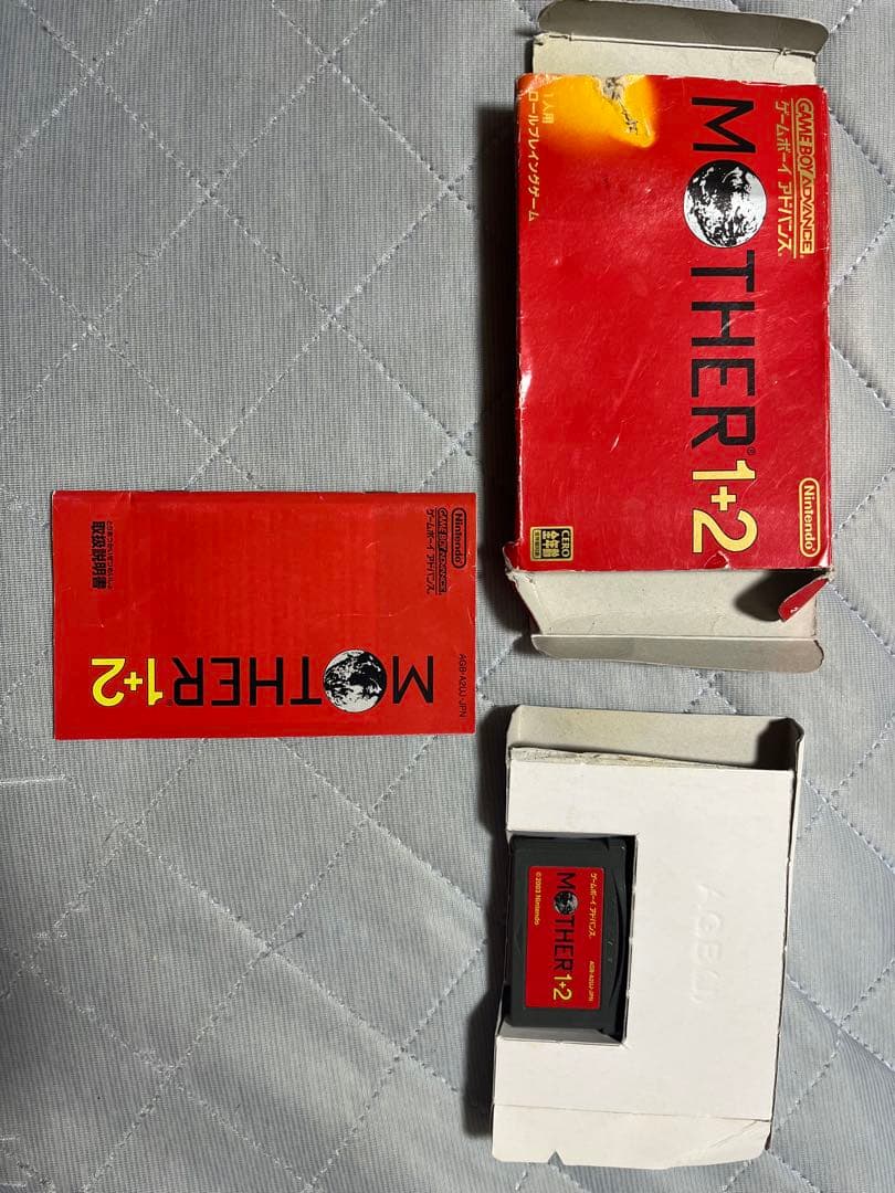 MOTHER1+2 used Game Boy Advance SP game cartridge with visible box scratches