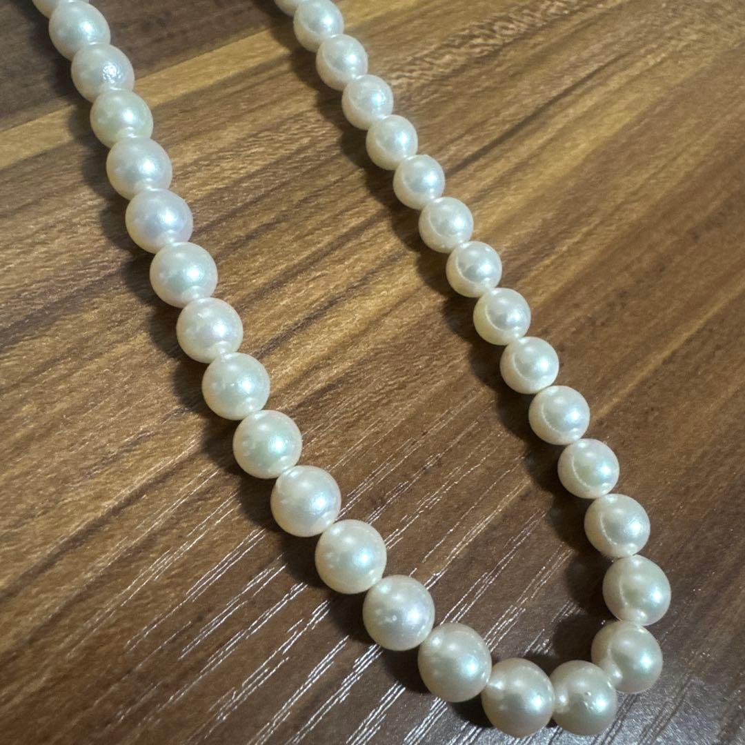 PLUSTER Akoya cultured pearl necklace with 8-8.5mm pearls and matching K14 white gold earrings on white background