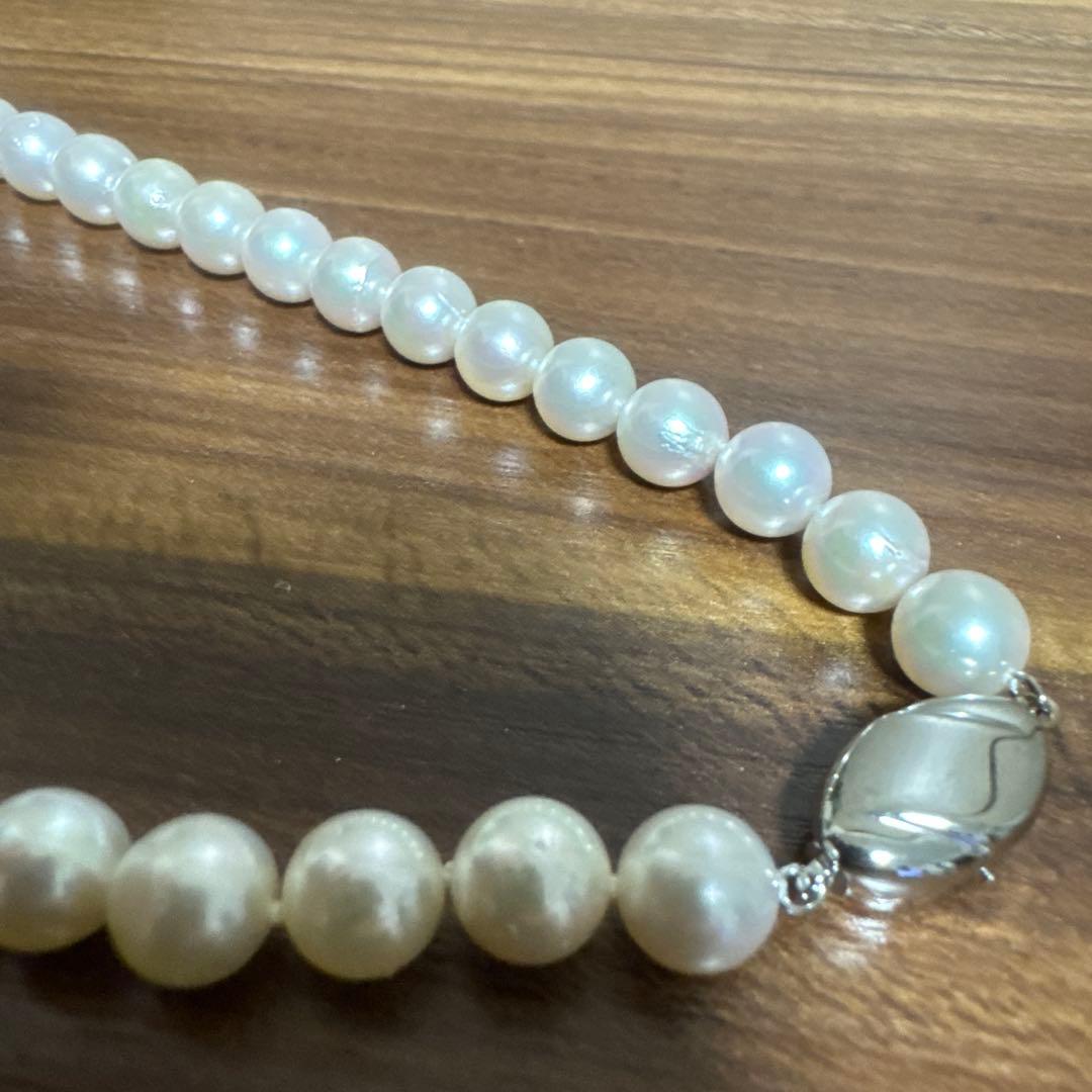 PLUSTER Akoya cultured pearl necklace with 8-8.5mm pearls and matching K14 white gold earrings on white background