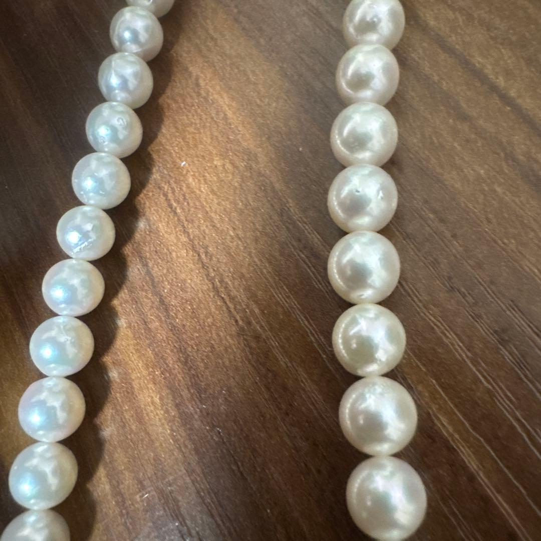 PLUSTER Akoya cultured pearl necklace with 8-8.5mm pearls and matching K14 white gold earrings on white background