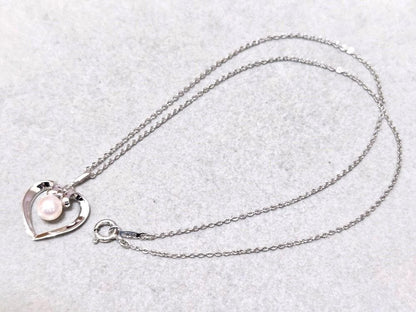 MIKIMOTO pearl silver necklace measuring about 40.5 cm with a box displayed