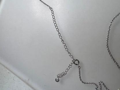 Mikimoto pearl necklace with decorative silver geometric pendant and removable rocket-shaped charm on adjustable chain
