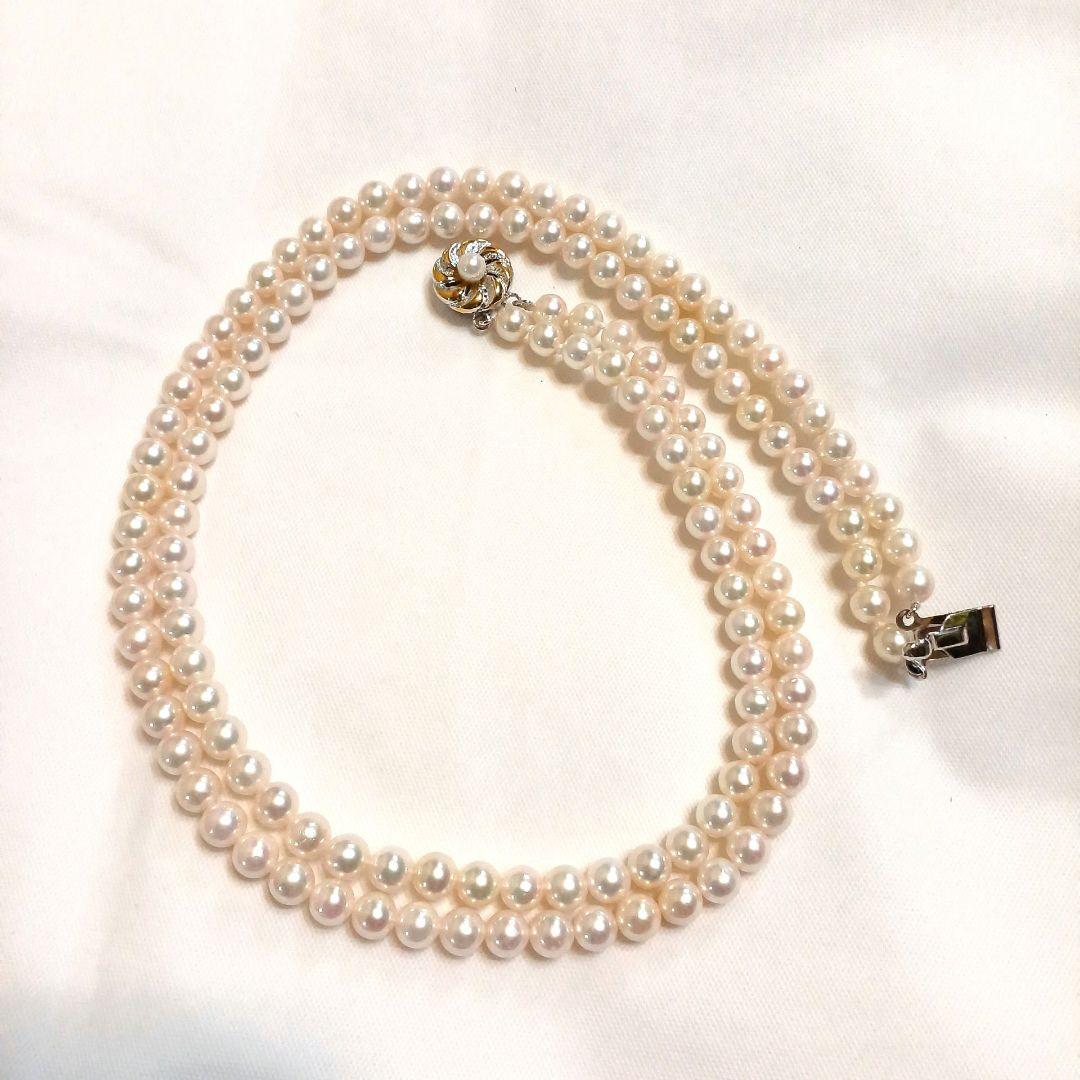 Akoya pearl double strand necklace with round pearls sized 5.5 to 5.8 mm and silver gold clasp