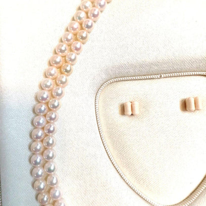Akoya pearl double strand necklace with round pearls sized 5.5 to 5.8 mm and silver gold clasp