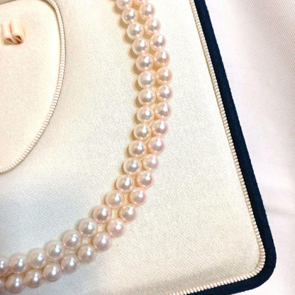 Akoya pearl double strand necklace with round pearls sized 5.5 to 5.8 mm and silver gold clasp