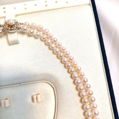 Akoya pearl double strand necklace with round pearls sized 5.5 to 5.8 mm and silver gold clasp