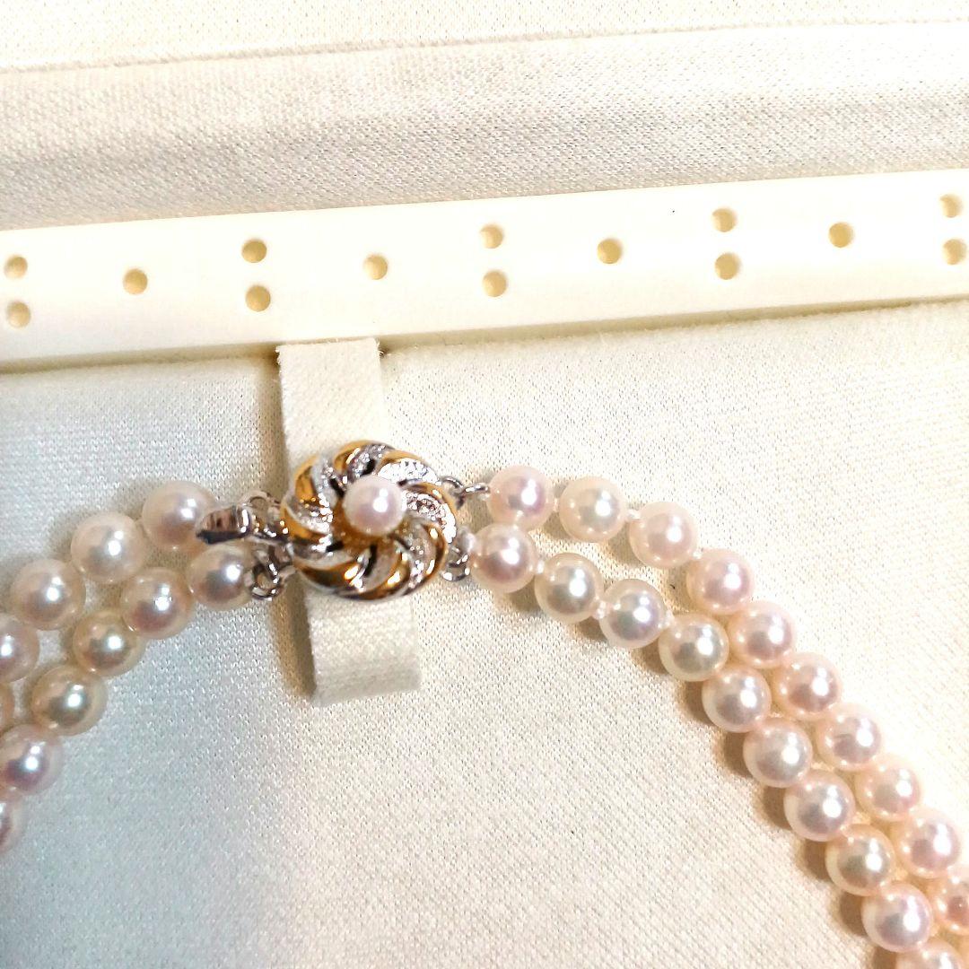 Akoya pearl double strand necklace with round pearls sized 5.5 to 5.8 mm and silver gold clasp
