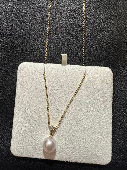 MIKIMOTO 18K gold necklace with pearl and diamond decorations displayed in a dedicated case