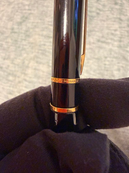 Black Waterman fountain pen with golden decorations and W logo on the cap