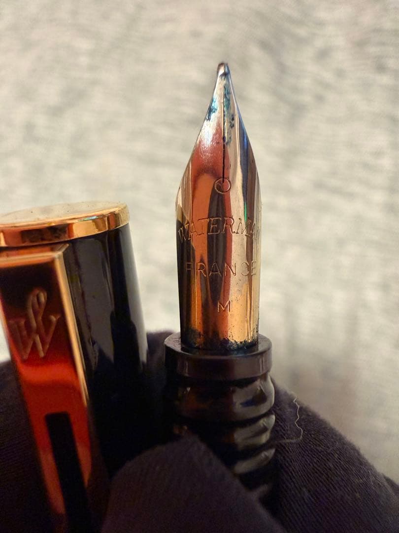 Black Waterman fountain pen with golden decorations and W logo on the cap