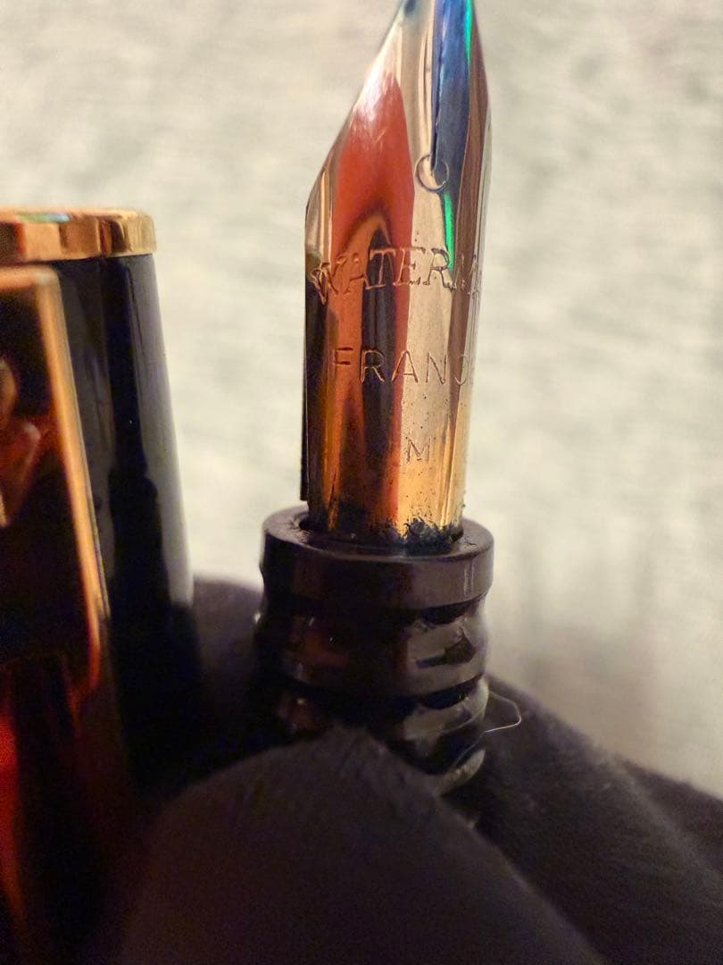 Black Waterman fountain pen with golden decorations and W logo on the cap