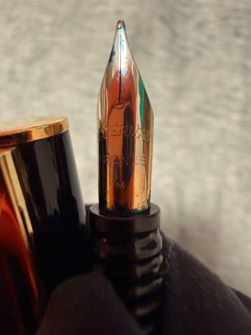 Black Waterman fountain pen with golden decorations and W logo on the cap