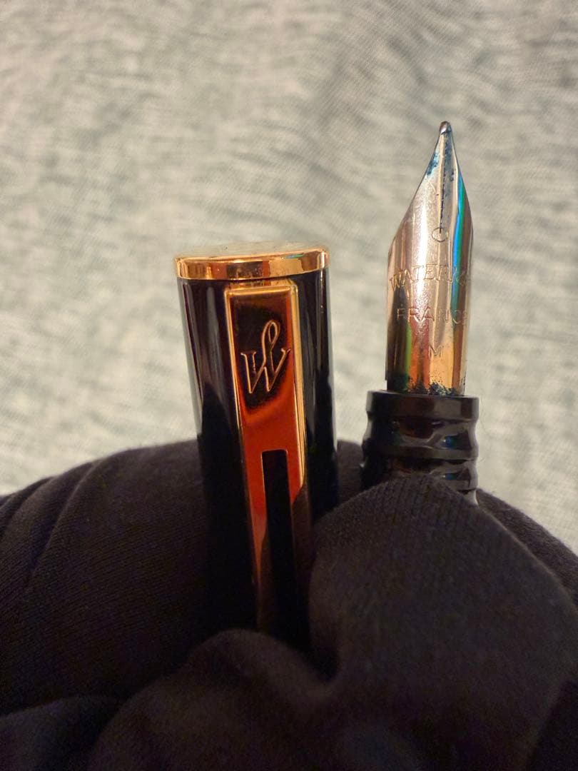 Black Waterman fountain pen with golden decorations and W logo on the cap