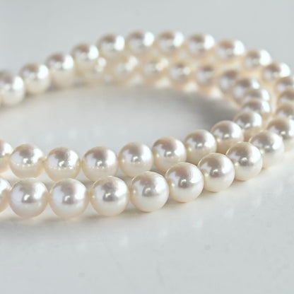 Highest grade Hanadama Tama Saki Akoya pearl necklace with lustrous white pearls on a fine strand