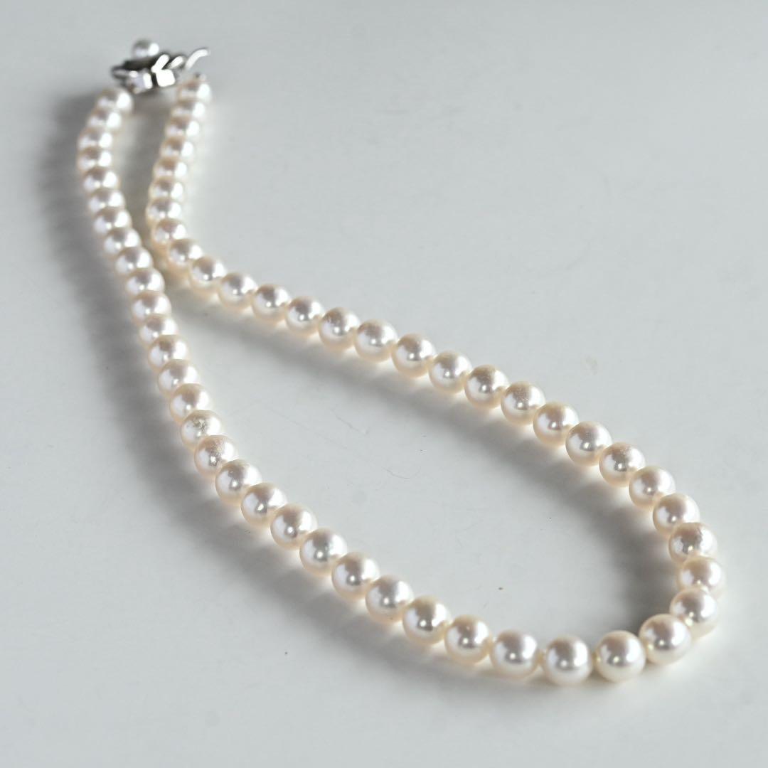 Highest grade Hanadama Tama Saki Akoya pearl necklace with lustrous white pearls on a fine strand