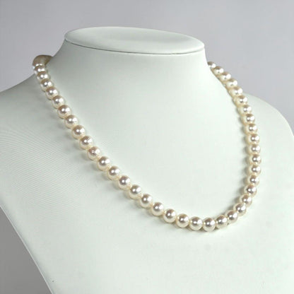 Highest grade Hanadama Tama Saki Akoya pearl necklace with lustrous white pearls on a fine strand