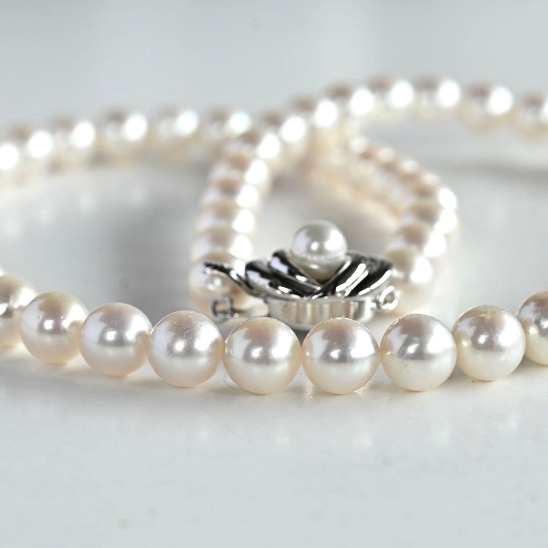 Highest grade Hanadama Tama Saki Akoya pearl necklace with lustrous white pearls on a fine strand