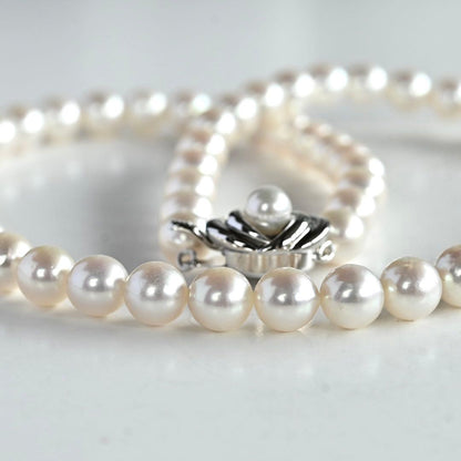 Highest grade Hanadama Tama Saki Akoya pearl necklace with lustrous white pearls on a fine strand