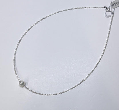 Akoya Keshi Necklace featuring small baroque pearls and a greenish pink Akoya pearl on a 42cm wire finish chain with metal clasp