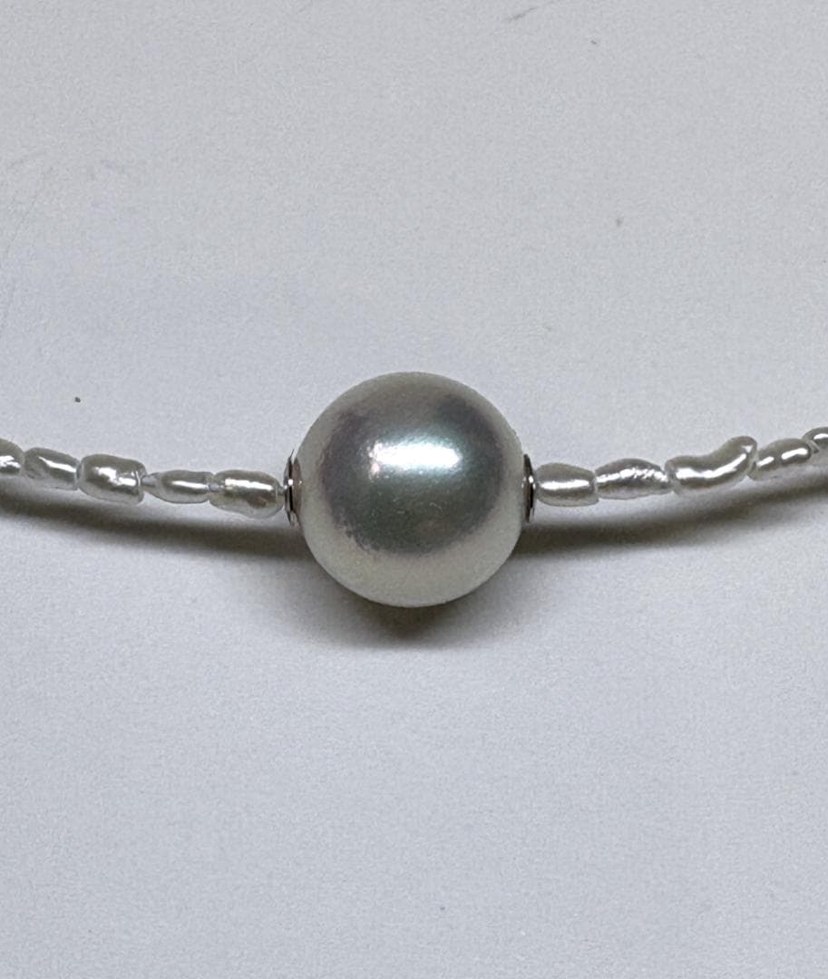 Akoya Keshi Necklace featuring small baroque pearls and a greenish pink Akoya pearl on a 42cm wire finish chain with metal clasp