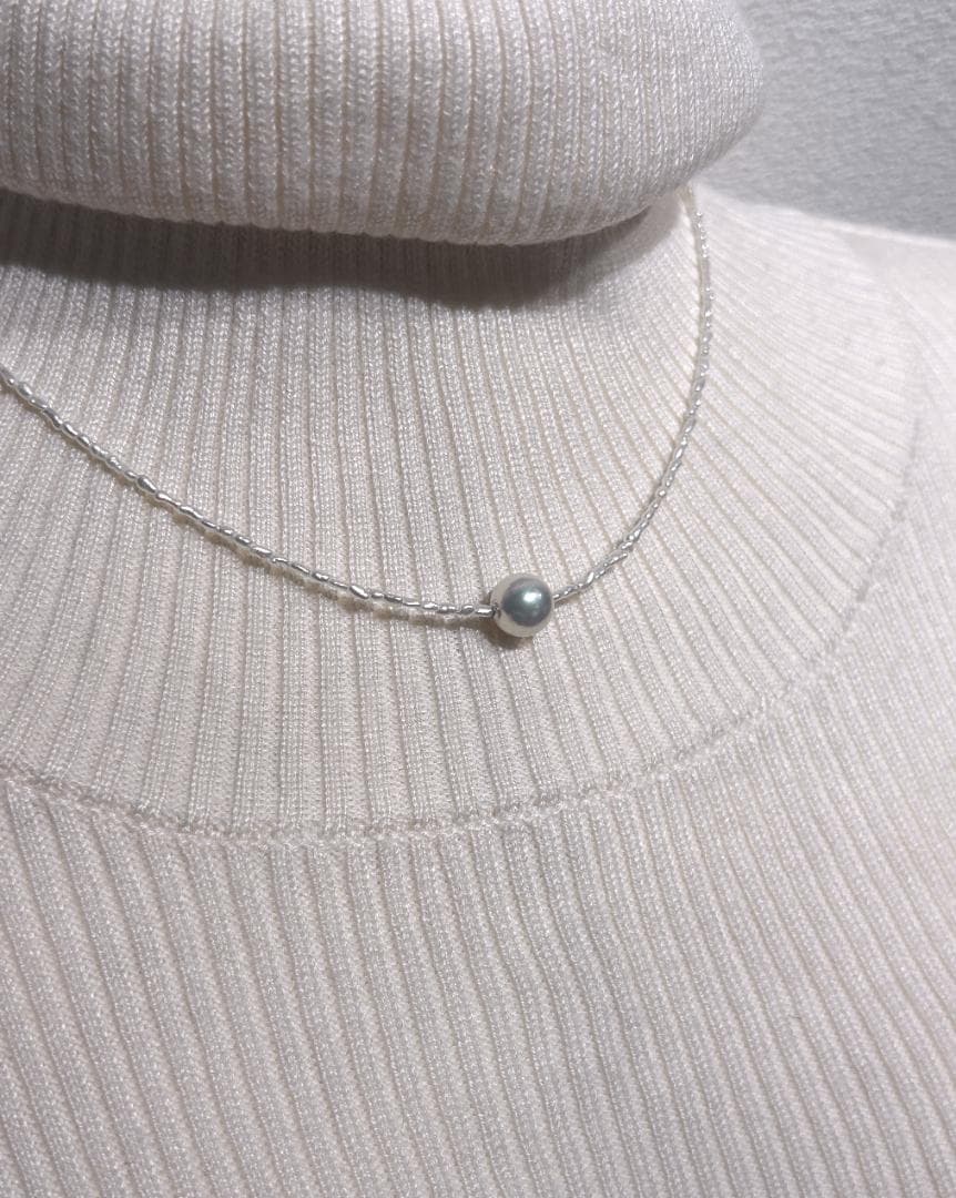 Akoya Keshi Necklace featuring small baroque pearls and a greenish pink Akoya pearl on a 42cm wire finish chain with metal clasp