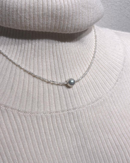 Akoya Keshi Necklace featuring small baroque pearls and a greenish pink Akoya pearl on a 42cm wire finish chain with metal clasp
