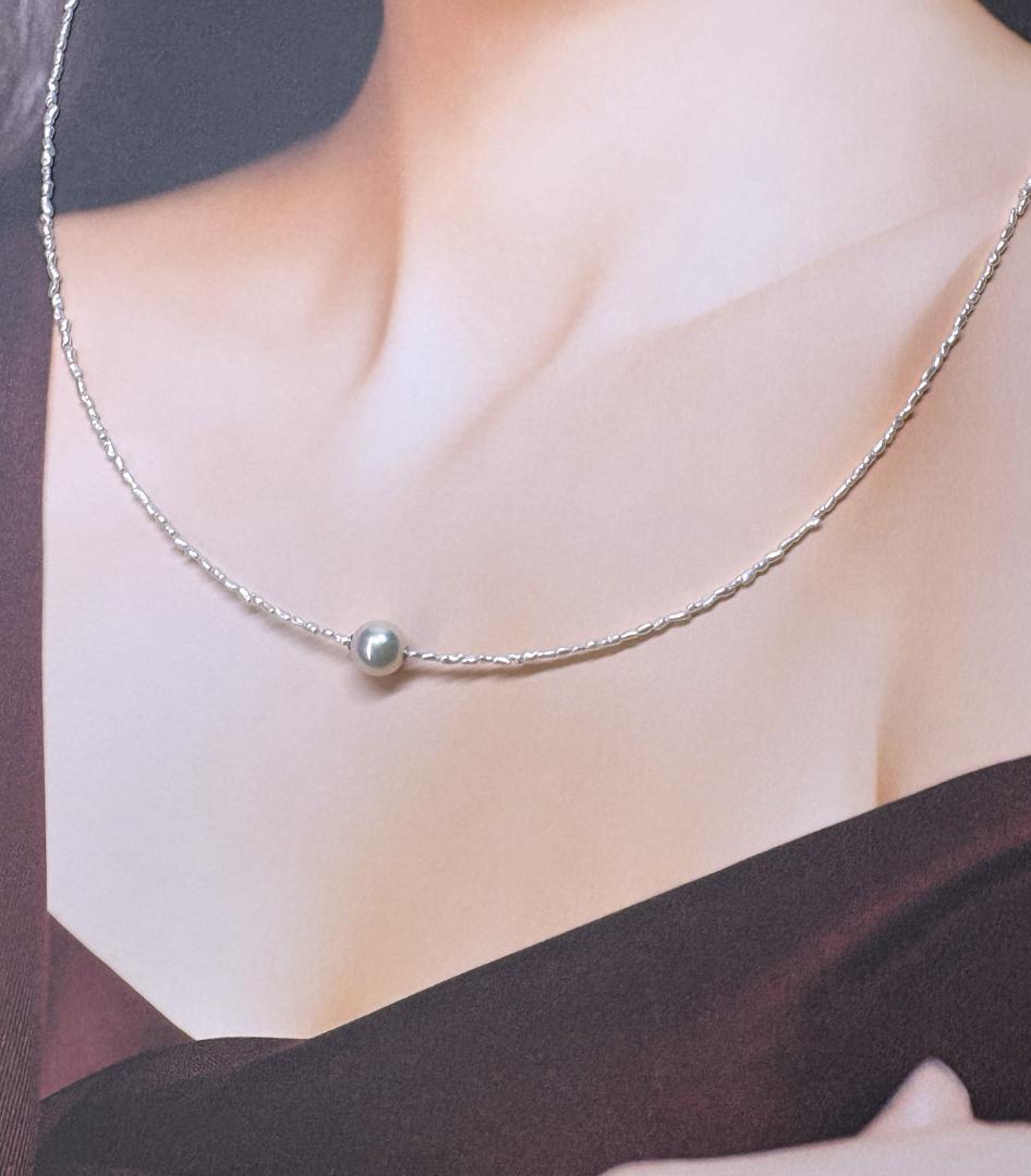 Akoya Keshi Necklace featuring small baroque pearls and a greenish pink Akoya pearl on a 42cm wire finish chain with metal clasp